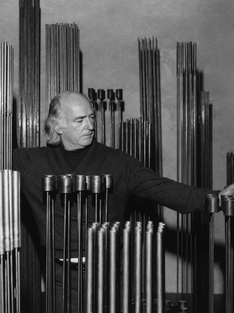 Harry Bertoia surrounded by his free-standing metal sonambient sculptures
