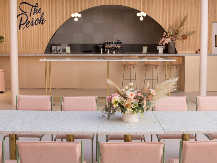 The Perch co-working space Chiara deRege interior design pink chairs floral centerpiece